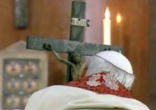 Image of Blessed John Paul II kissing the feet of the Crucified Christ