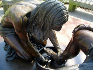 Jesus washed the Disciples' feet to show that nobody is above serving their neighbor.