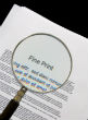 Image of President Obama has been pushing secret laws hidden within the fine print of other, bigger, laws (iStock).