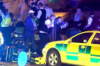 Police work the crime scene where a terrorist drove a van into a crowd of people in Finley Park, London.