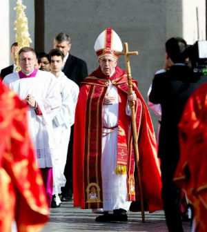 'We have been saved by his cross,' said Pope Francis on Palm Sunday.