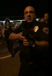 Image of The unidentified officer will be found and it is unclear if he will face discipline for threatening to kill journalists. 