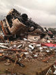 Image of The unusual weather spawned tornadoes which hurled vehicles through the air. Ten people died in storms on Wednesday.