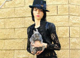 Image of Nasim Aghdam had a bizarre YouTube account where she posted images of herself with animals. She accused YouTube of censoring her videos and reducing viewership and advertising payments for her content. 